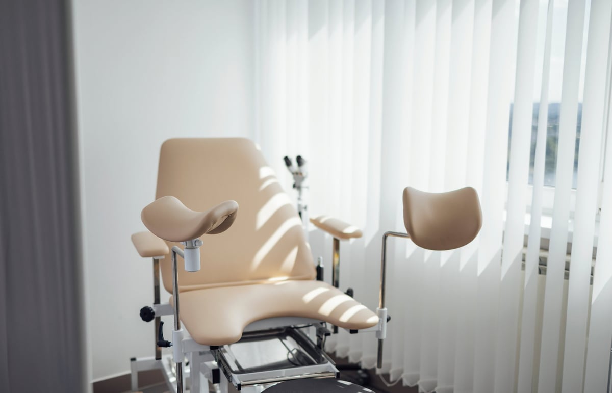 Gynecological chair. Modern bright office of the gynecologist. Sunny day.